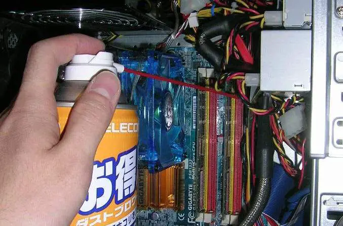 When should you use an air compressor to clean out your computer?