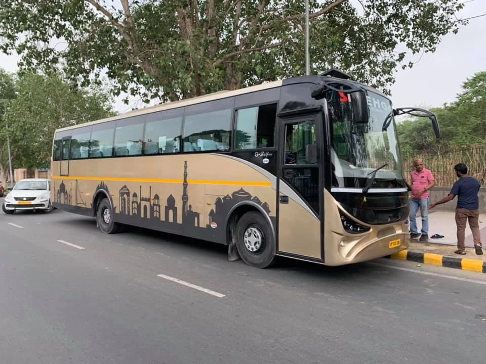 What are the Pricing Options and Booking Process for Renting a Bus in Delhi? Are There Any Special Discounts or Packages?