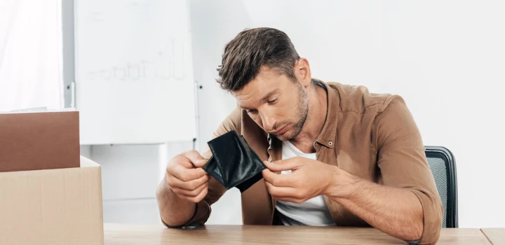 How to start an emergency fund while paying off debt?