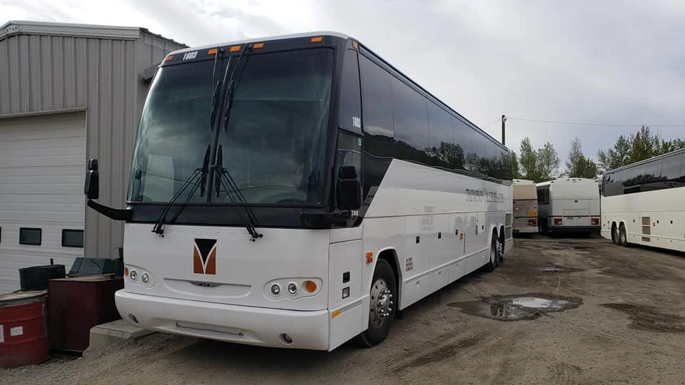 Navigating Bus Schedules with the Assistance of Charter Bus Company Employees