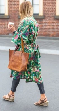 What is the difference between full-grain leather and genuine leather tote bags?