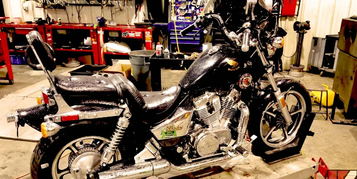 Why is my motorcycle clutch fluid level dropping quickly?