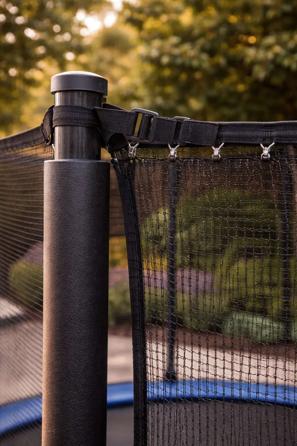 Secure trampoline safety net attached properly to trampoline poles.