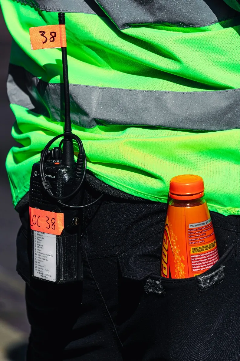 A radio in the pocket of a security guard