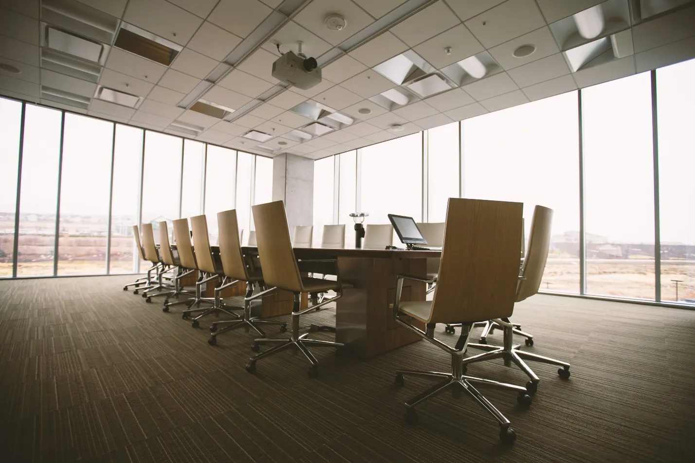  A conference room in an office with a long table and chairs