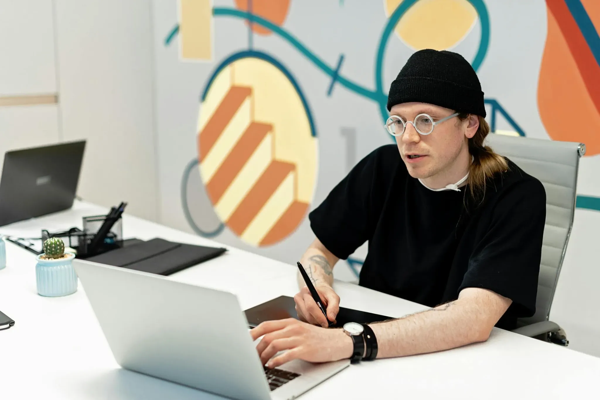designer converting artwork into clean vector paths using design software on a computer