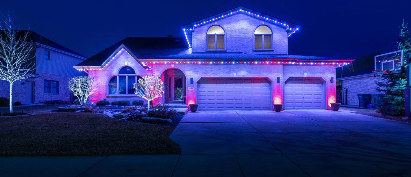 Year-round color-changing permanent outdoor lighting enhancing home curb appeal