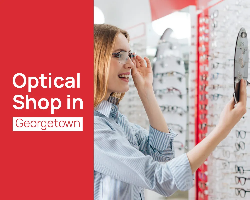 Woman trying eyeglasses at an optical shop in Georgetown