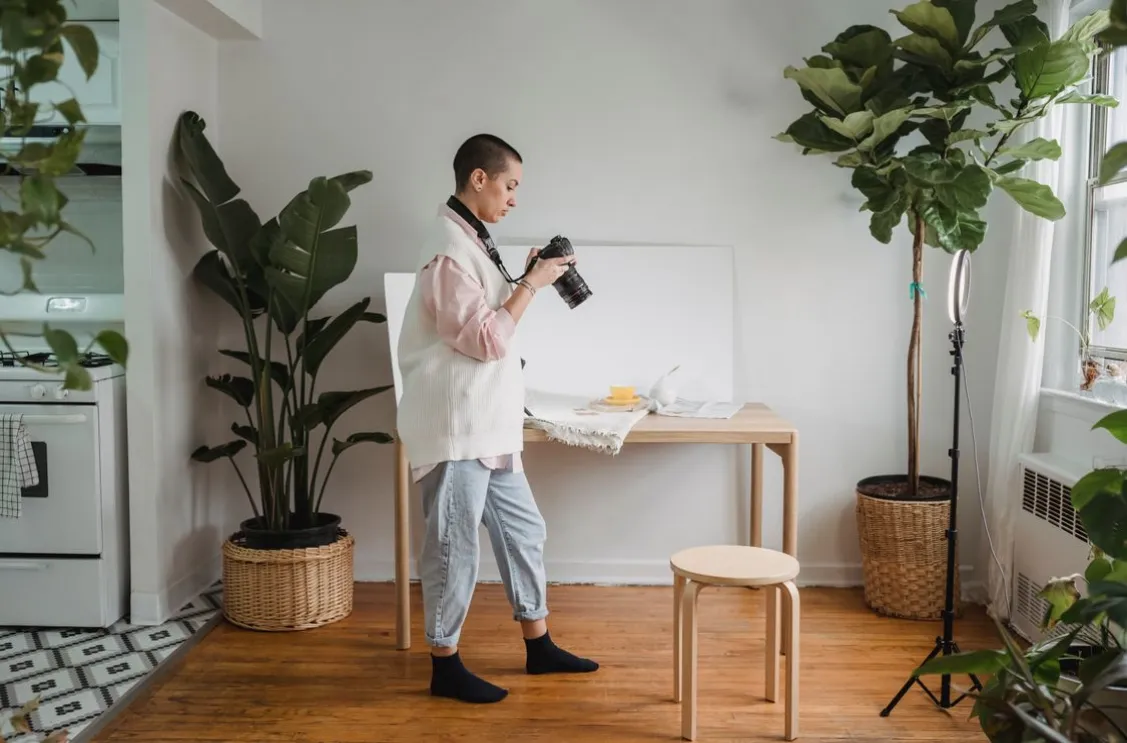 a photographer setting up for a home staging shoot