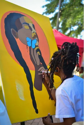 Woman painting on canvas 