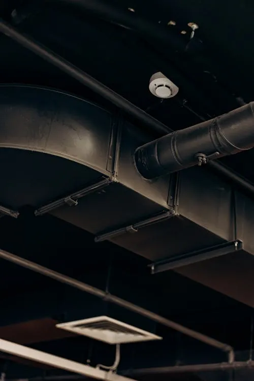 Modern HVAC ductwork and ventilation system inside a building.