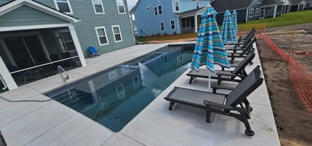 Concrete vs Pavers: Pool Deck Options for Fiberglass Pools