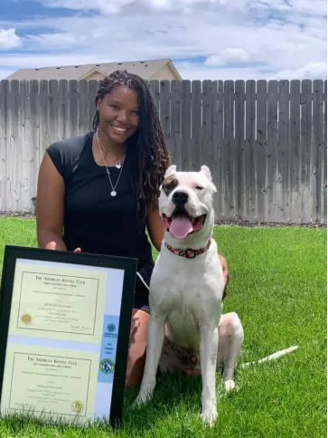 This photo shows a dog smiling at the camera.