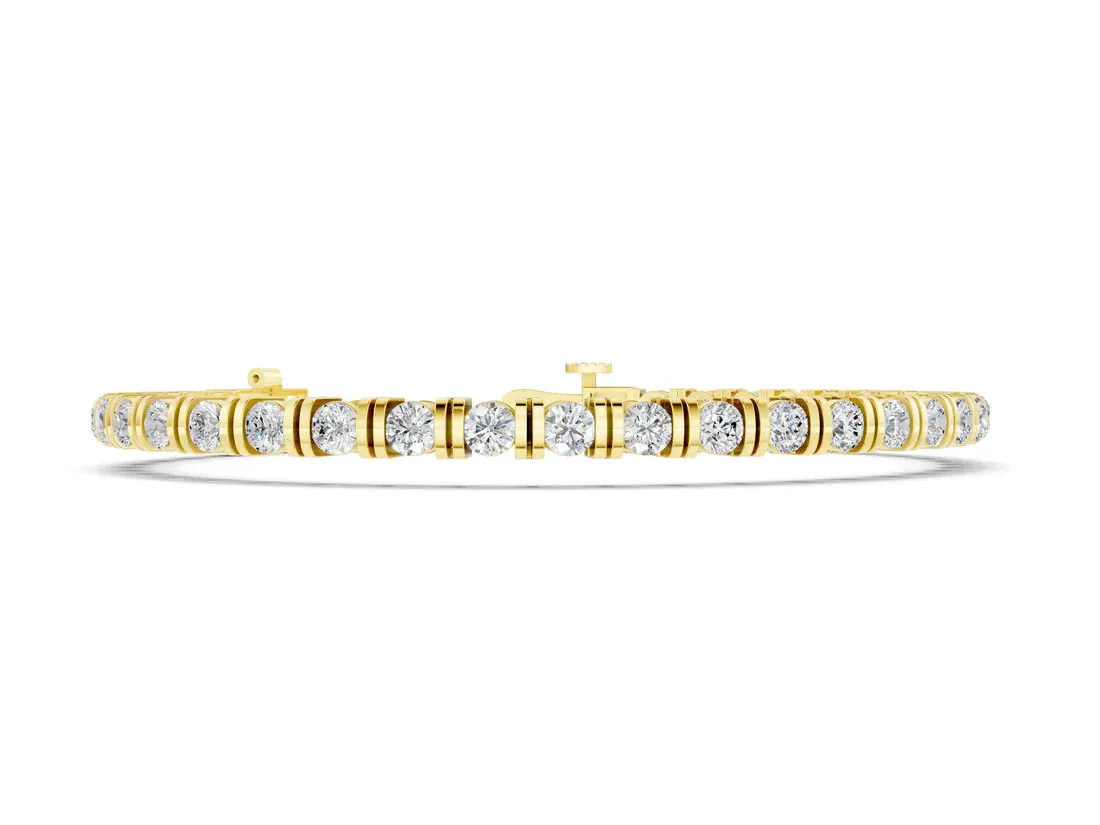 The Sleek Sophistication of the Yellow Gold Round Brilliant Tennis Bracelet with Channel Set Stones and Box Clasp