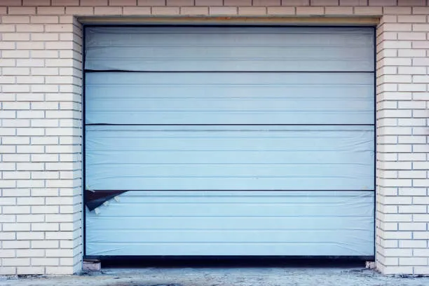 Garage Door Panel Repair or Replacement: How to Choose the Right Solution