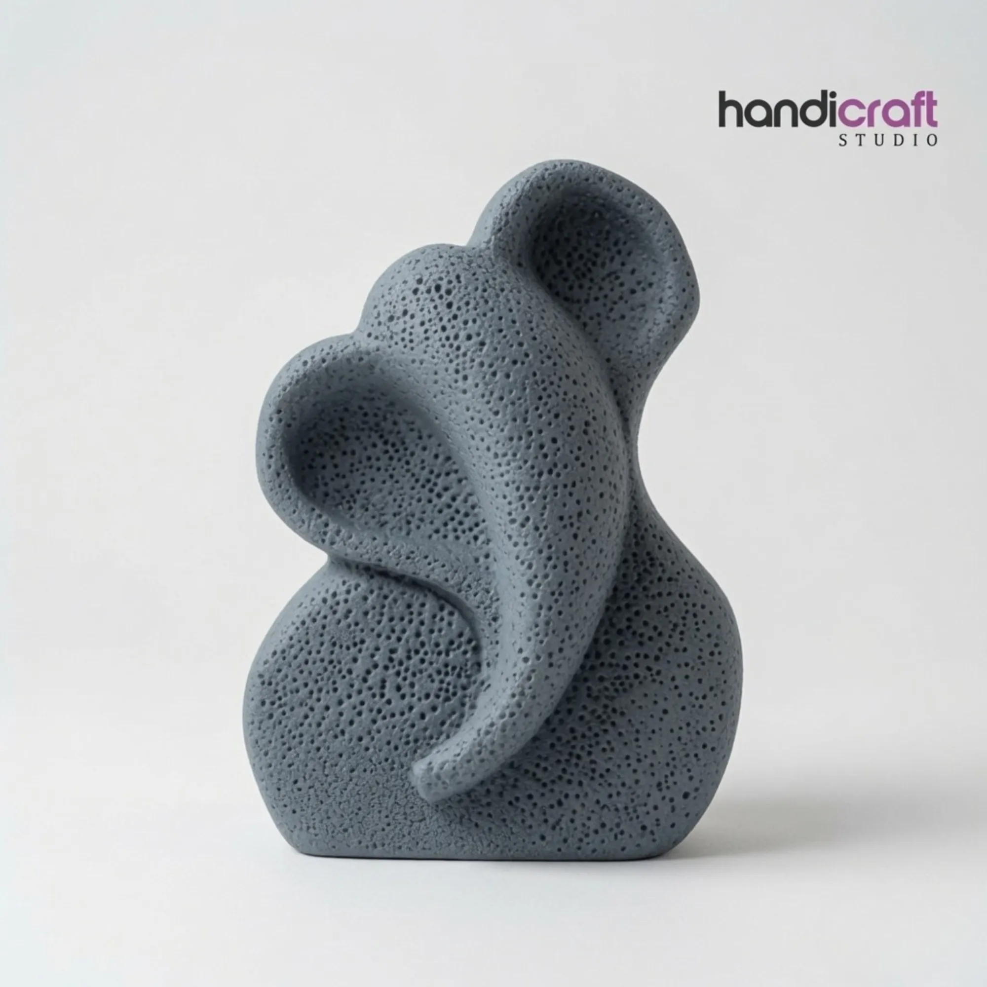 Modern abstract Lord Ganesha idol in textured slate gray