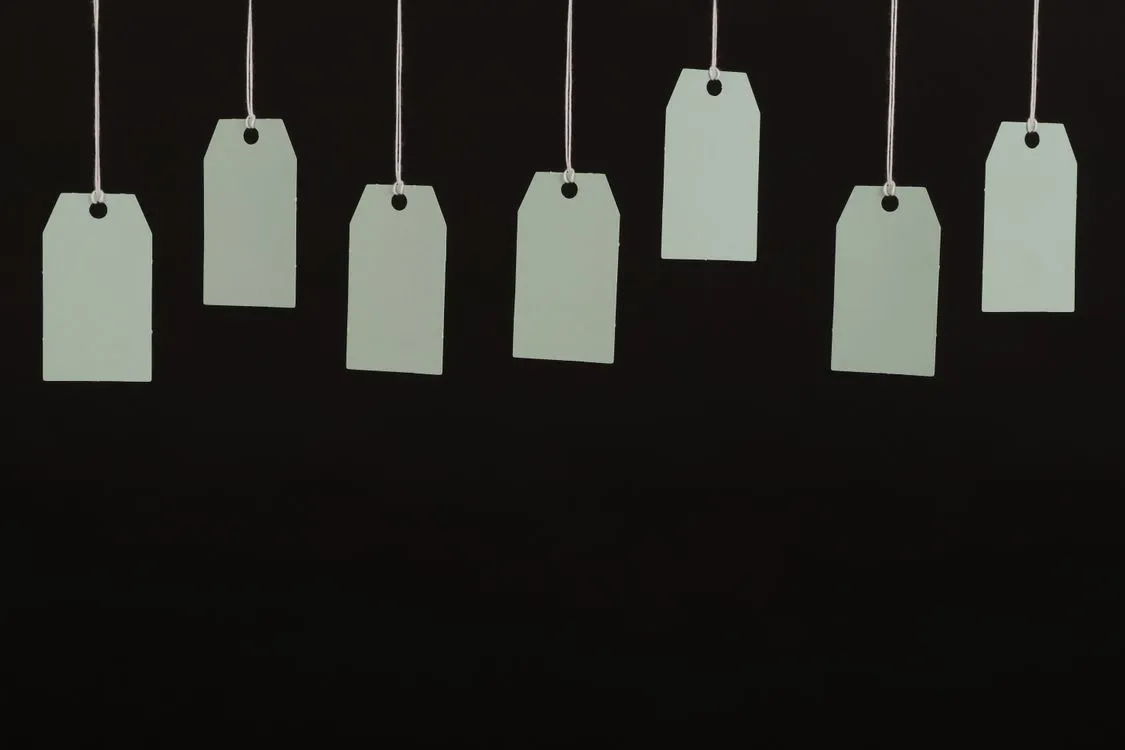 a row of hanging tags