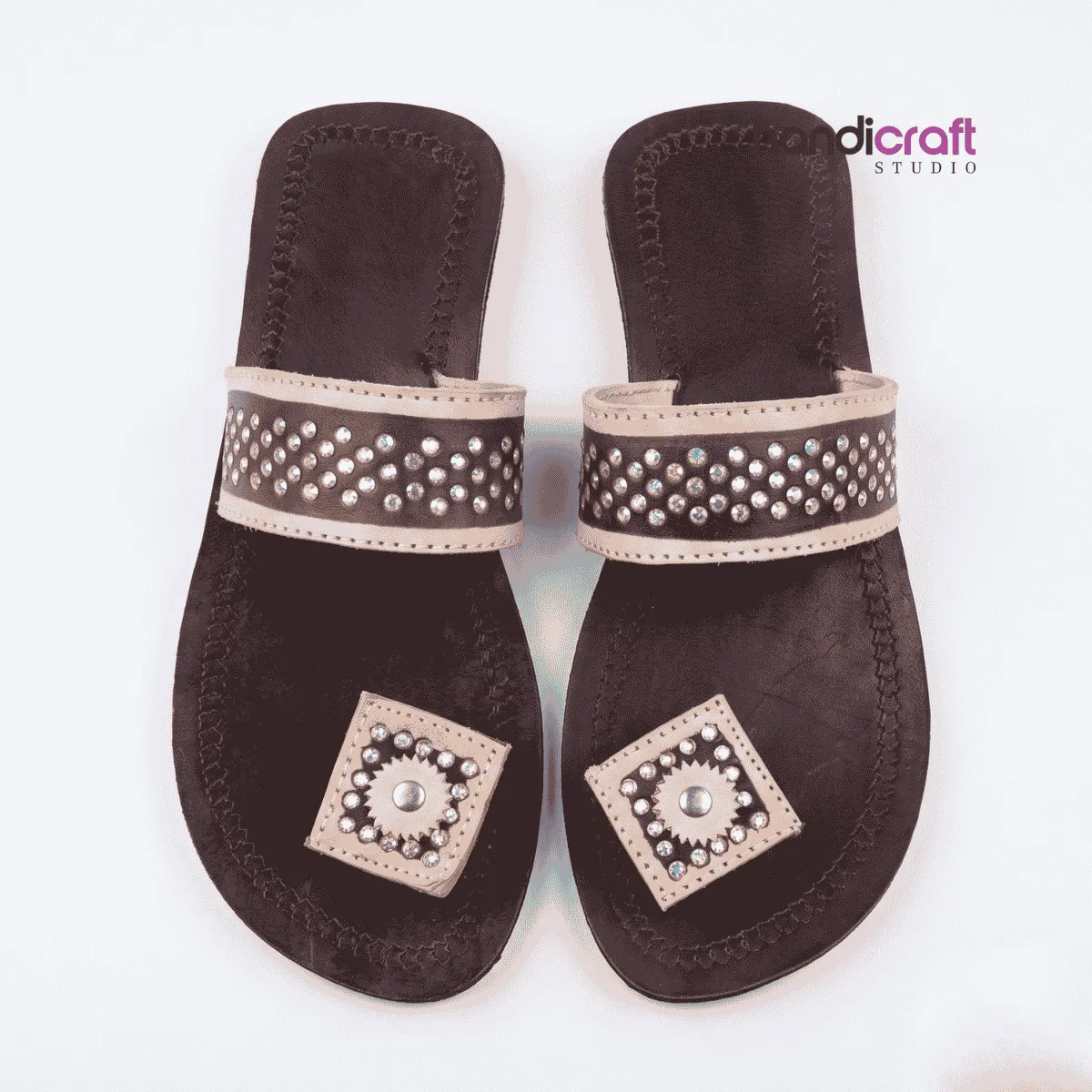 Authentic dark brown Himachali leather chappal for women with light beige studded square patch and wide strap.