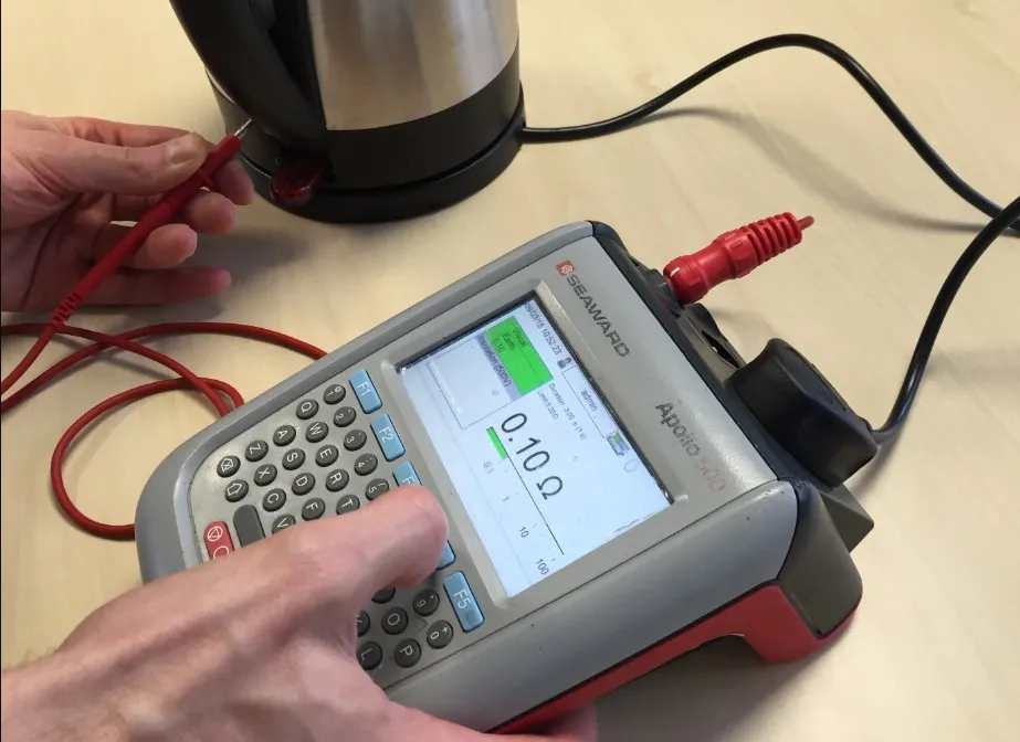 Why Does the IET Code of Practice Classify a Kettle Differently to a Washing Machine?
