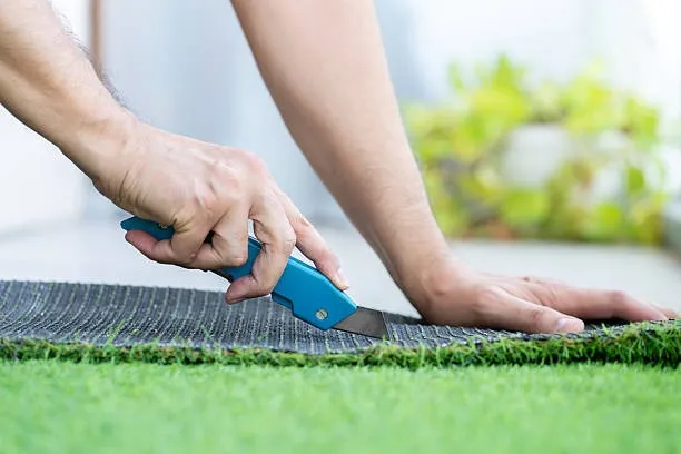 What type of artificial grass is used for tennis courts?
