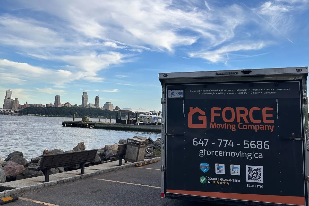 G Force Moving trailer with the New York City skyline across the Hudson River