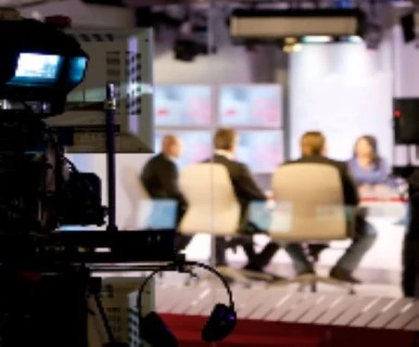 What benefits may companies receive in the field of corporate video production by investing in high-caliber videos made by a reliable production company?