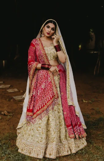 Golden Hand Embroidered Bridal Lehenga With Dark Red Bandhani Dupatta: A Traditional and Elegant Choice for Your Special Day