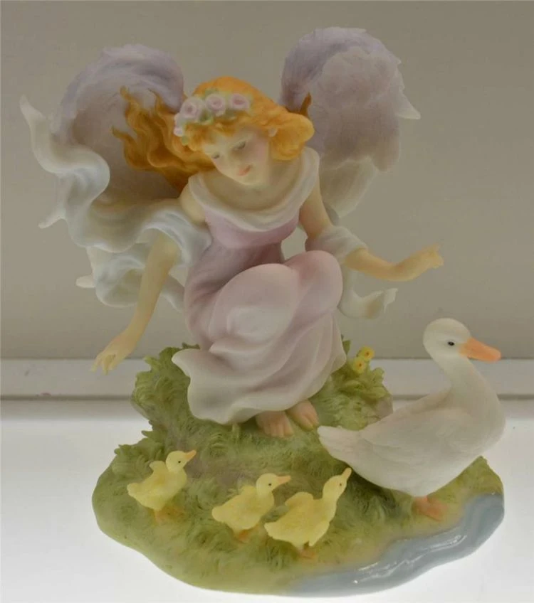Angelic Elegance Personified: The Graceful Art of Angel Figurine Crafting!