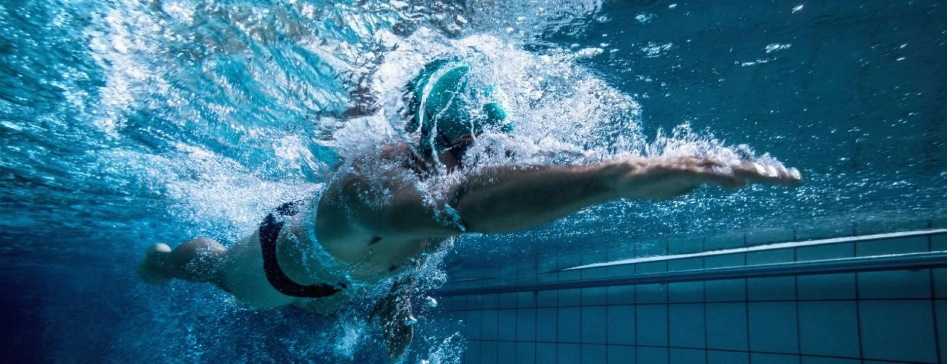 Why is it important to wear goggles in a pool?