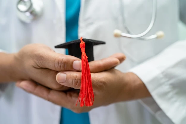 Asian doctor study learn with graduation gap hat in hospital ward clever bright genius education medicine concept