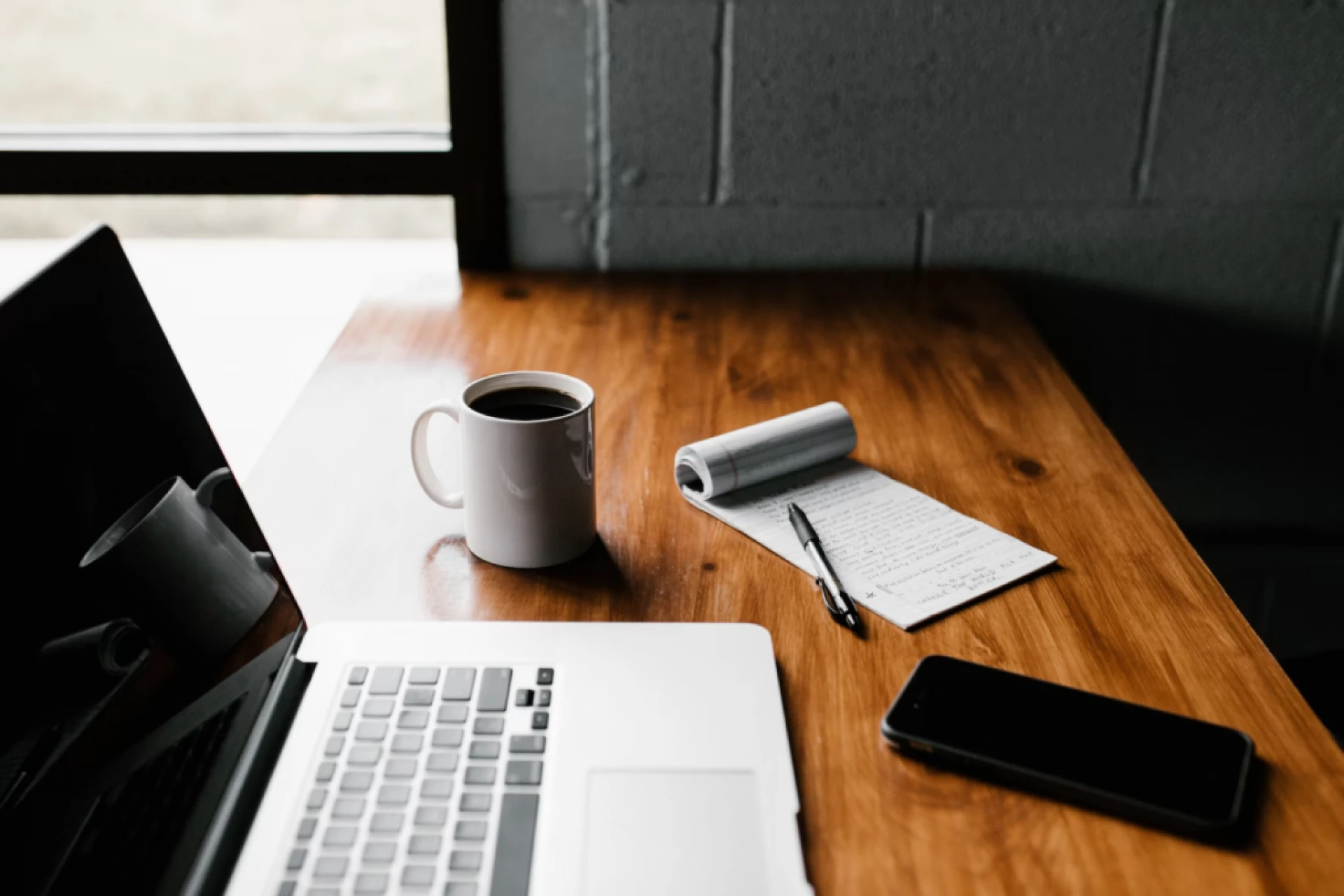 A laptop lying with a cup of coffee. Writing a blog post!