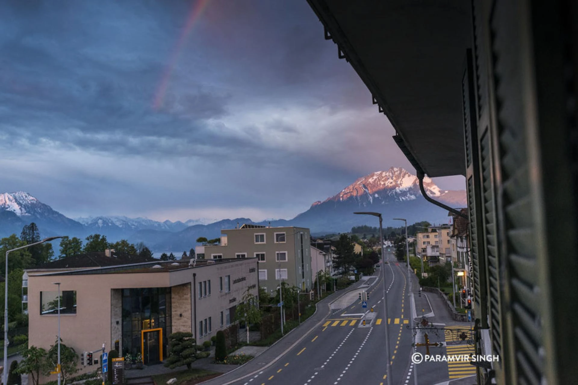 Rainbow from the window over Alps in Lucerne.