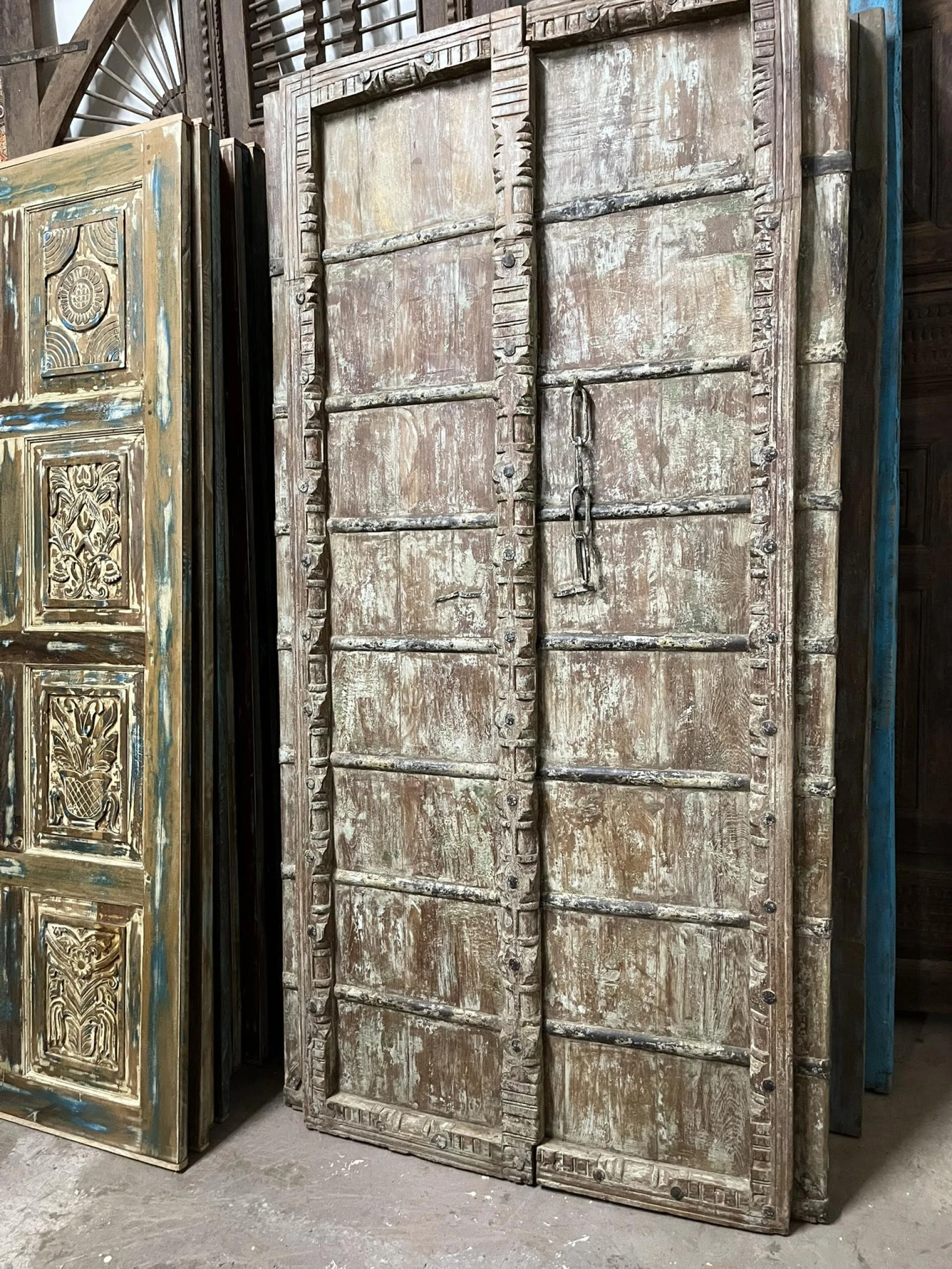 More is More: Moody Blue Carved Doors in Mogul Interior Wellness Decor