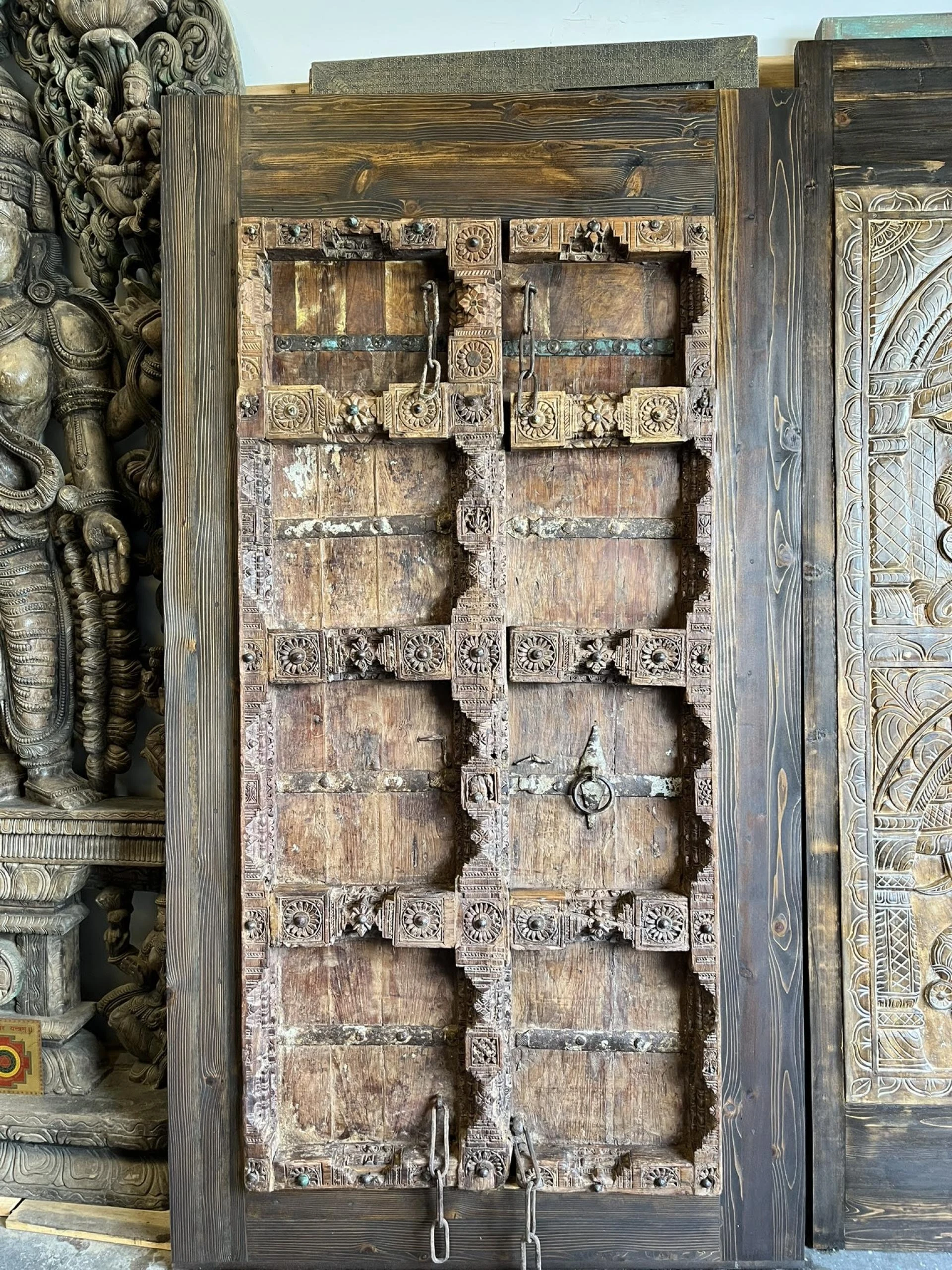 More is More: Moody Blue Carved Doors in Mogul Interior Wellness Decor