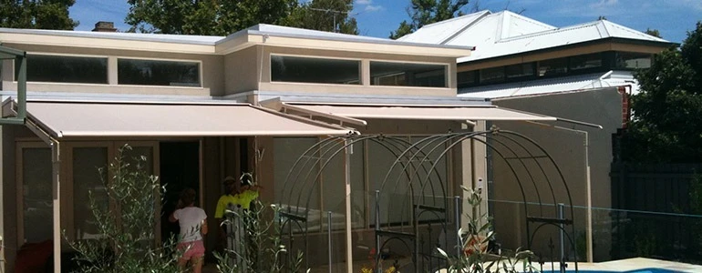 Why a Retractable Awning with Drop Screen Is Ideal for Patios and Balconies