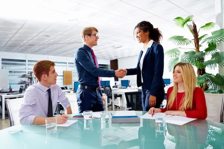 executive handshake business people at meeting