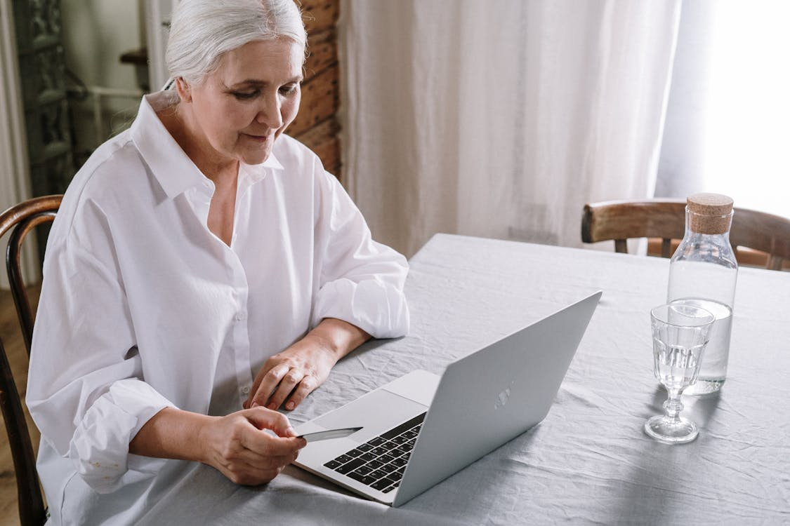 Elderly woman using a laptop