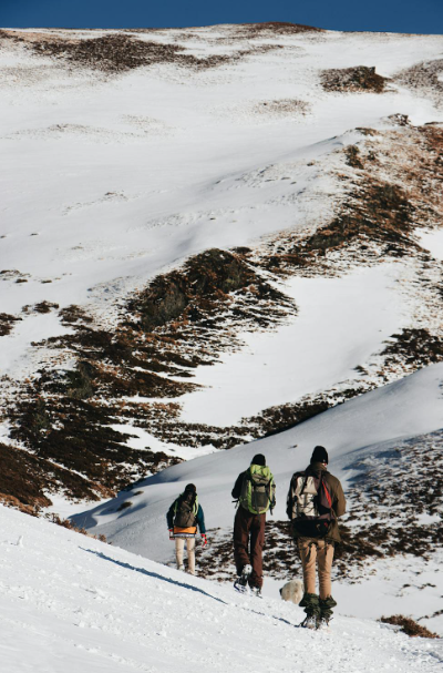 A group of hikers on an icy terrain.