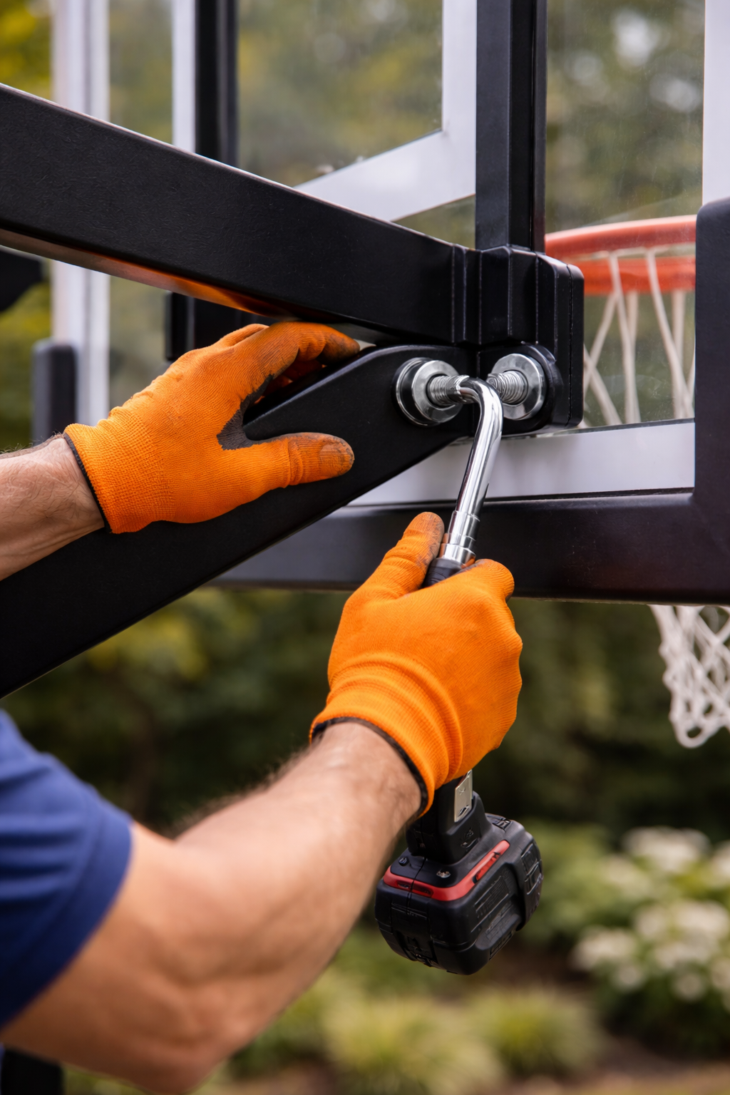 Professional technician performing maintenance on a basketball hoop system.