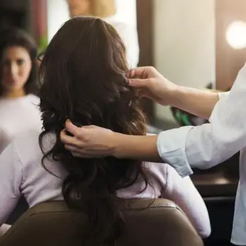 bigstock-Hairdresser-Making-Curls-To-Cl-246790264_1080x-c11507d5