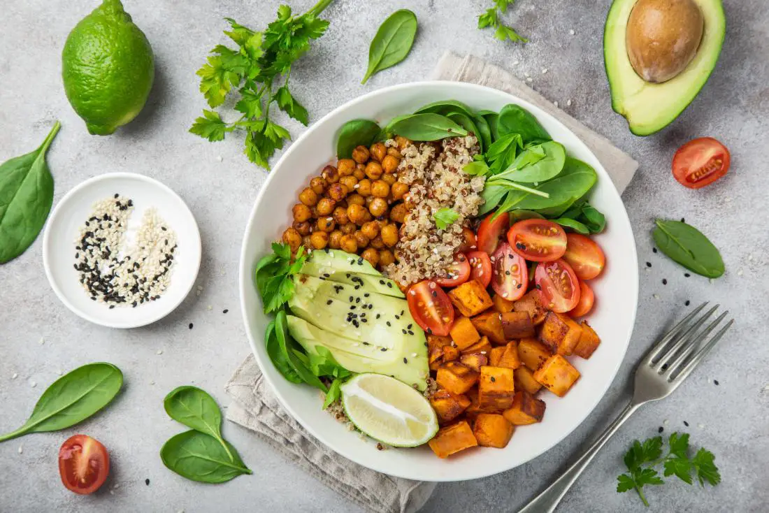 vegan-meal-with-chickpeas-quinoa-sweet-potato-avocado-lime-and-high-fiber-vegetables-and-legumes-for-pcos-diet-ac987974