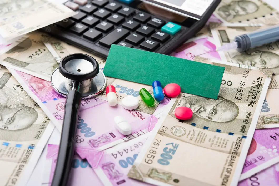 healthcare-india-concept-health-business-showing-indian-paper-currency-notes-stethoscope-pills-calculator-apple-fruit-stuffed-heart-toy-selective-focus_466689-64175-c612dd0b