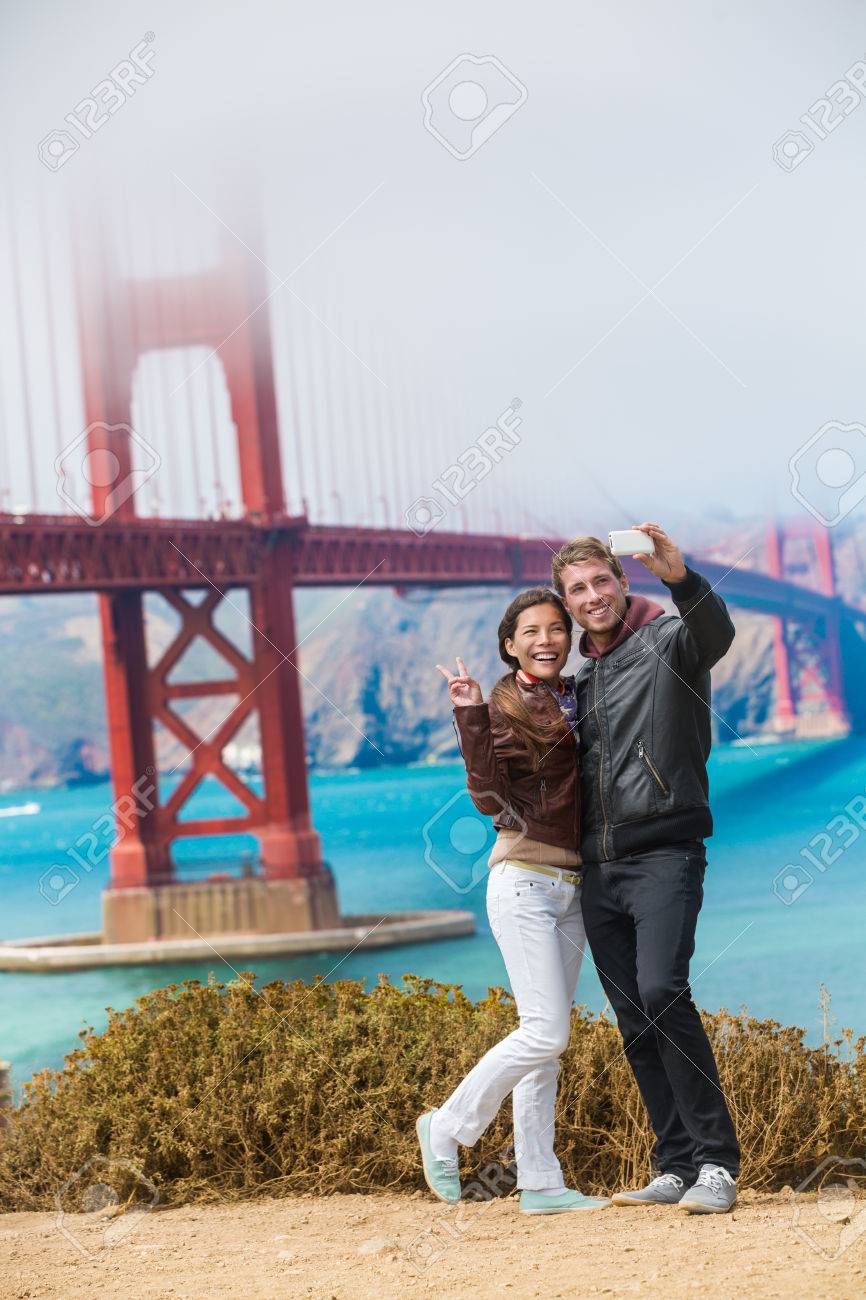 55652324-tourists-couple-taking-selfie-photo-in-san-francisco-by-golden-gate-bridge-interracial-young-modern--e406f1b7