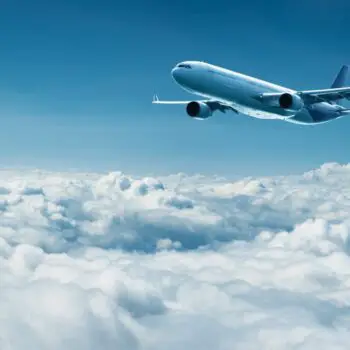 Airplane-flies-above-clouds-air-travel-212abccf