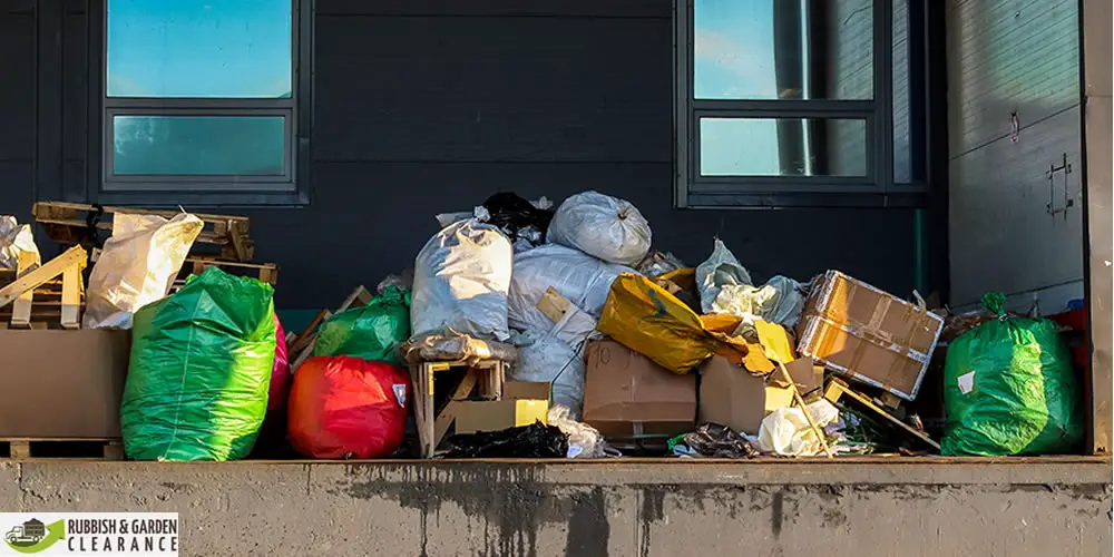 How does a rubbish clearance company in Merton contribute to a cleaner environment?