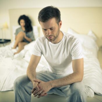 anxious-man-sat-on-the-end-of-his-bed-wondering-if-erectile-dysfunction-can-be-reversed-14584452