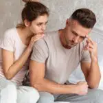 lovely-couple-sitting-bed-while-woman-calm-down-her-boyfriend-which-upset_171337-352-985fb59f