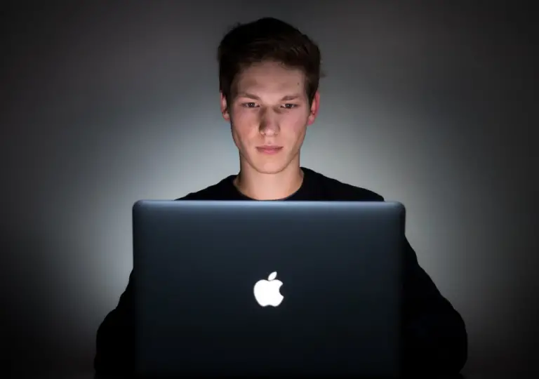 Person using a black MacBook