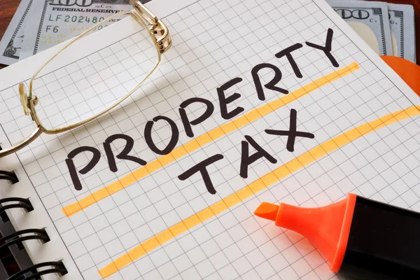 depositphotos_93319938-stock-photo-notebook-with-property-tax-sign-51a43ef9