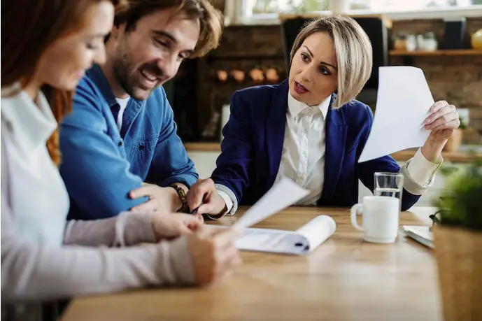 Screenshot 2023-01-24 at 12-27-17 Free Photo Insurance agent talking to young couple while analyzing document during a meeting at their home-0f8298e4